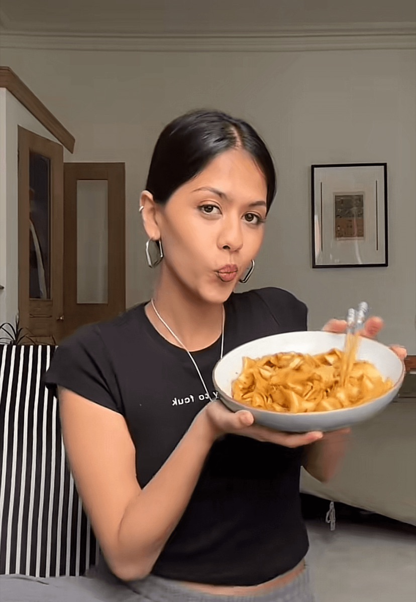 A creator sharing a dish to camera